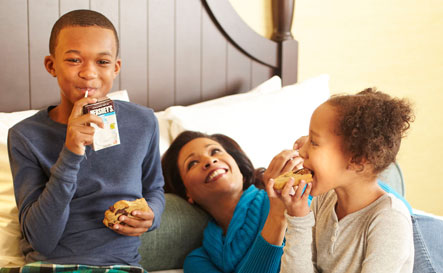 Family enjoying cookies in room at Hershey Lodge