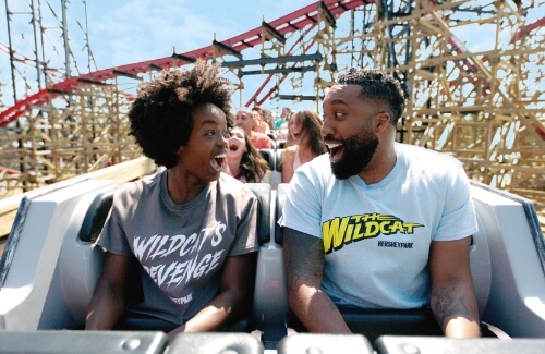Riders enjoying Wildcat's Revenge roller coaster at Hersheypark