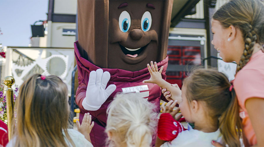 Family with Hershey Bar character at Hersheypark