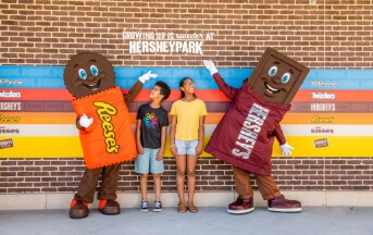Kids standing with Hershey Characters