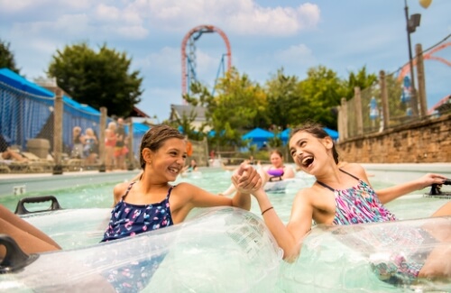 Two girls in lazy river at The Boardwalk At Hersheypark
