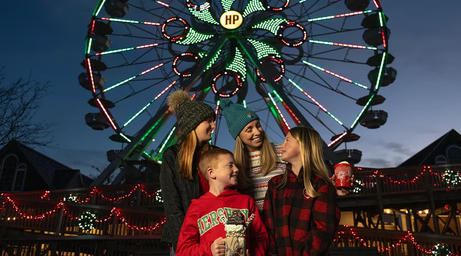 Mom and kids at the Hersheypark ferris wheel during Christmas