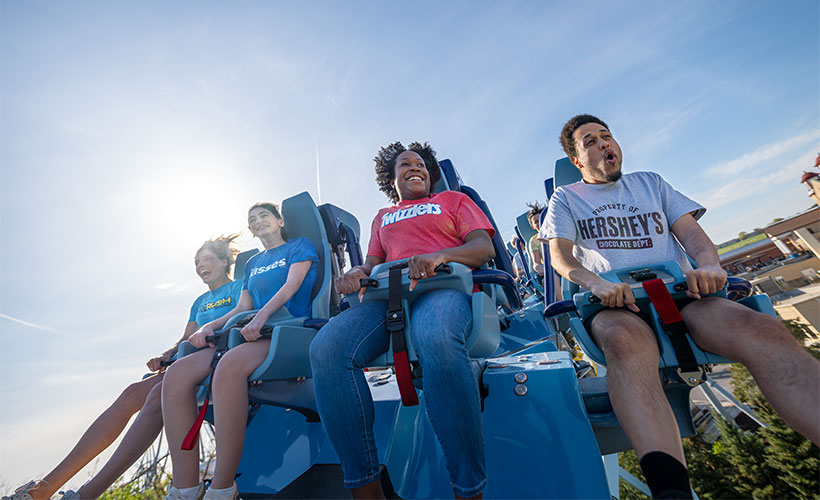 Family riding Skyrush