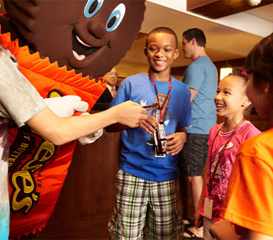 Kids with a Hershey character at the Lodge